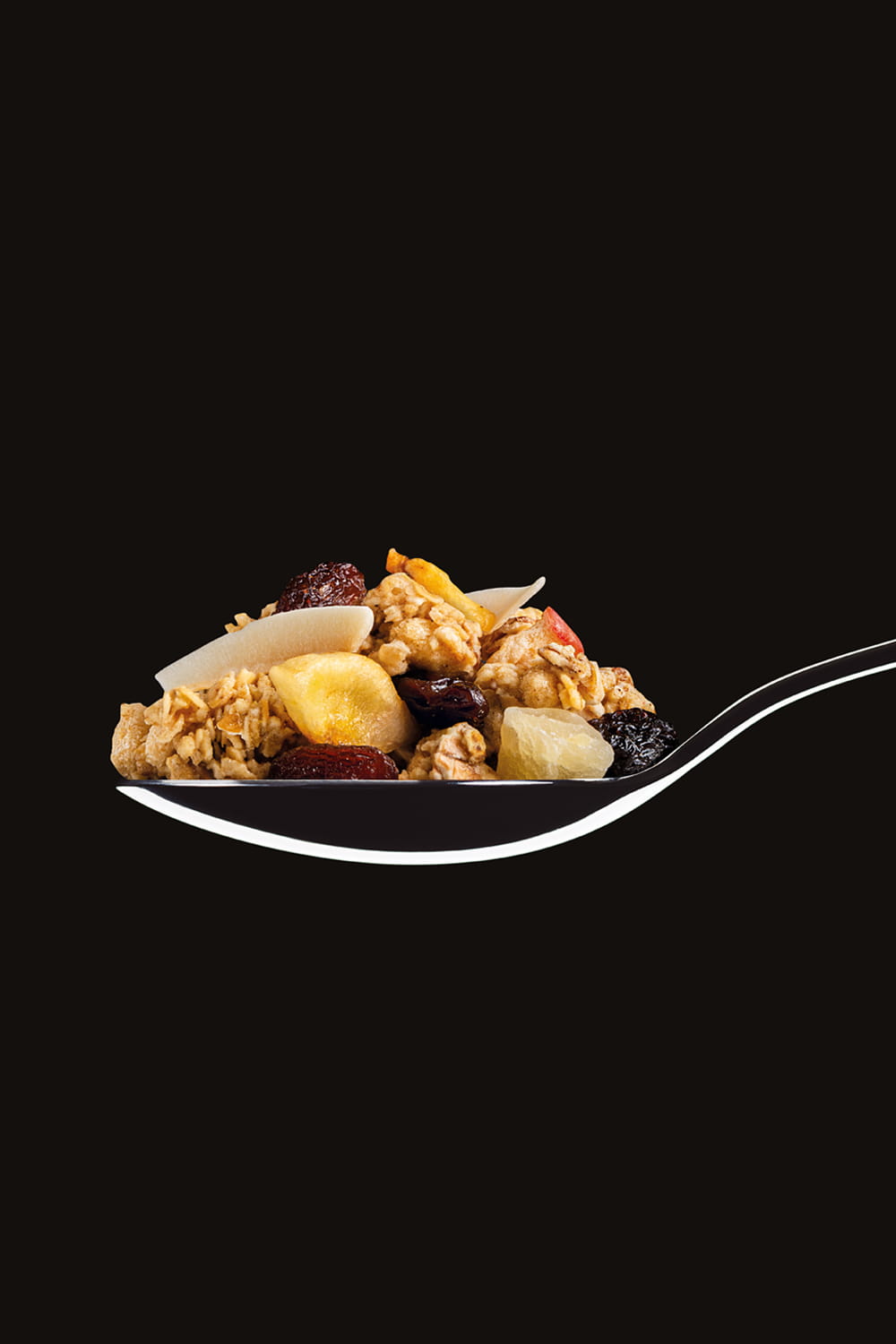 Fotografía premium de muesli con frutas sobre cuchara para packaging de Eroski realizada por Cristina Navarro